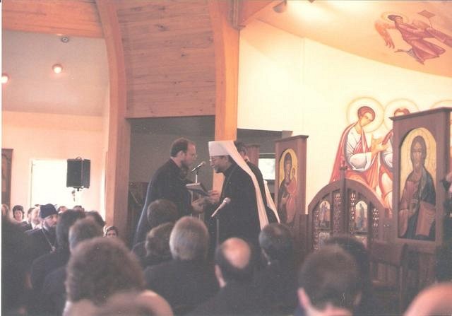 Ken was awarded the Ph.D. in 1986. Fr John then urged him to get a degree from an Orthodox institution, i.e. SVS. He received the M.Th. from SVS, May, 1988. Here, Metropolitan Theodosius hands him his diploma.